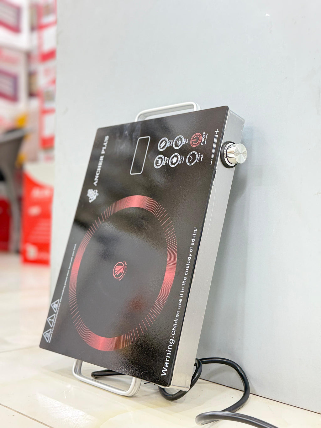 Portable gas stove with a pan on the burner