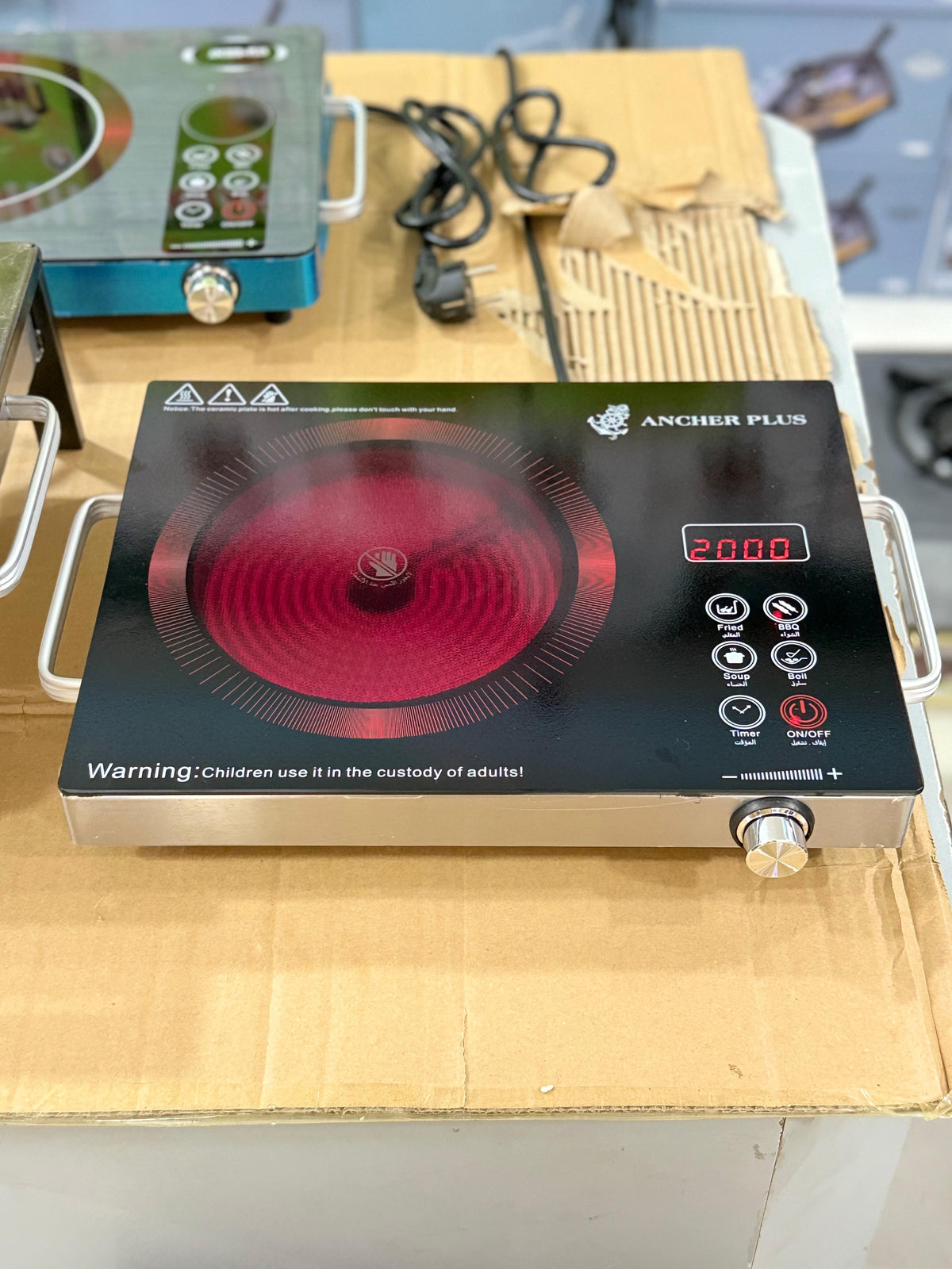 Portable gas stove shown with packaging