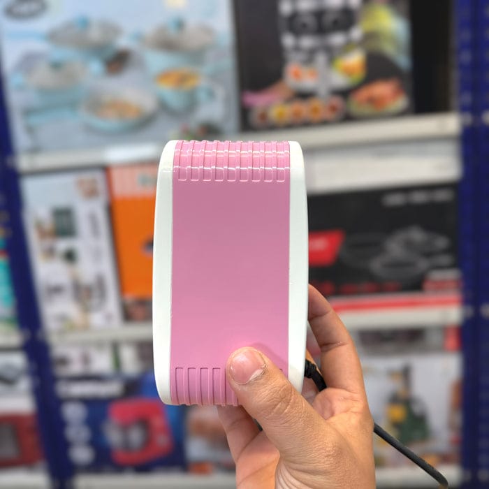 Mini electric heater on a desk