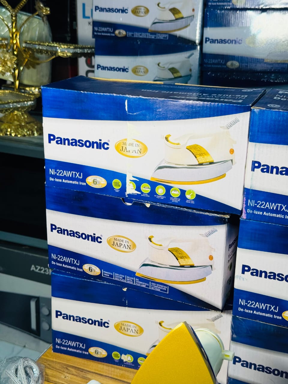 Panasonic dry iron shown with its box
